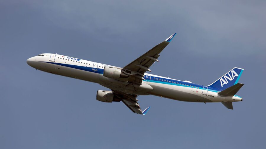 American passenger's aggressive behavior forced a flight en route to divert back to Tokyo.